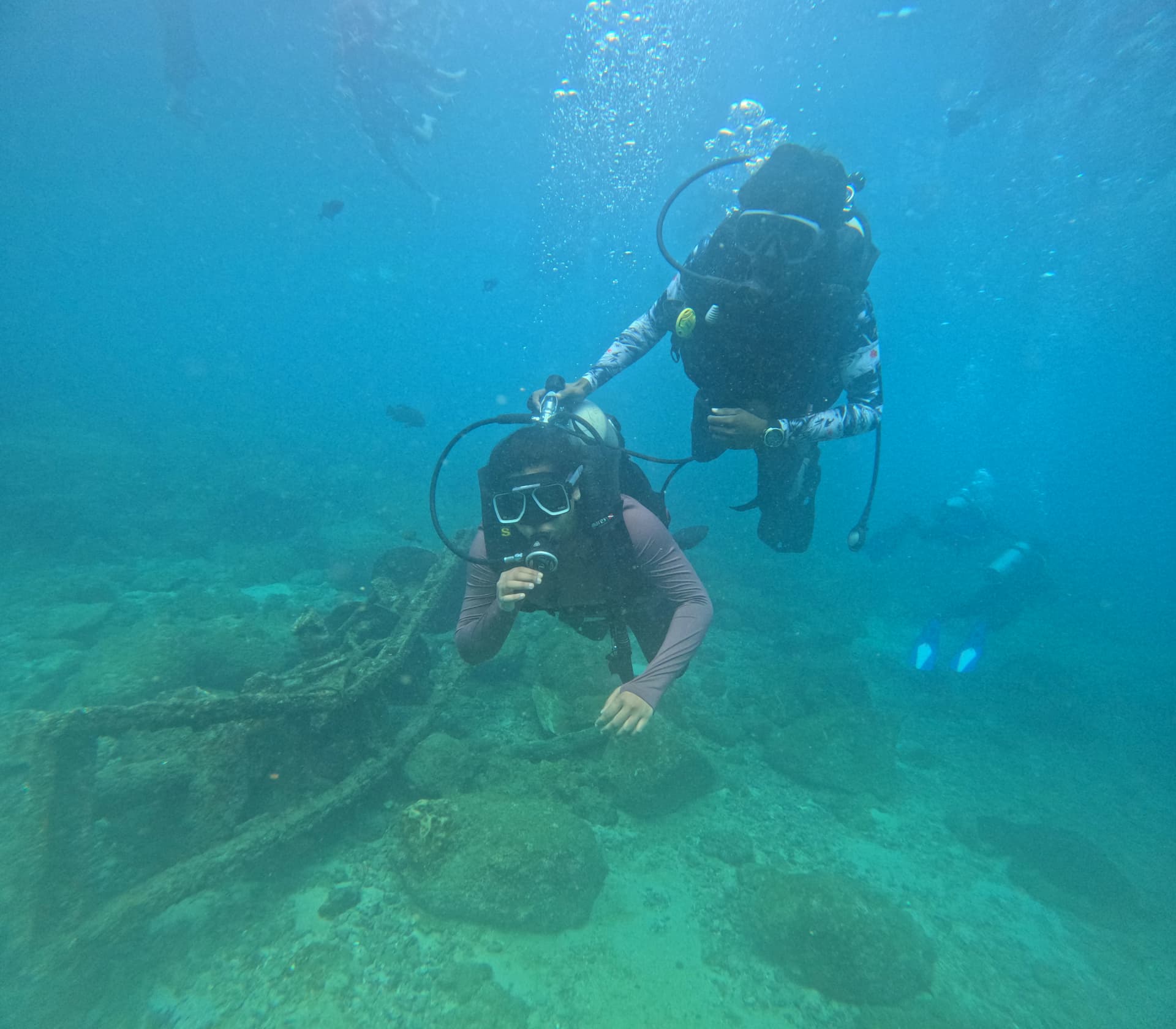 Certified scuba diver navigating clear turquoise Arabian Sea waters in Murudeshwar