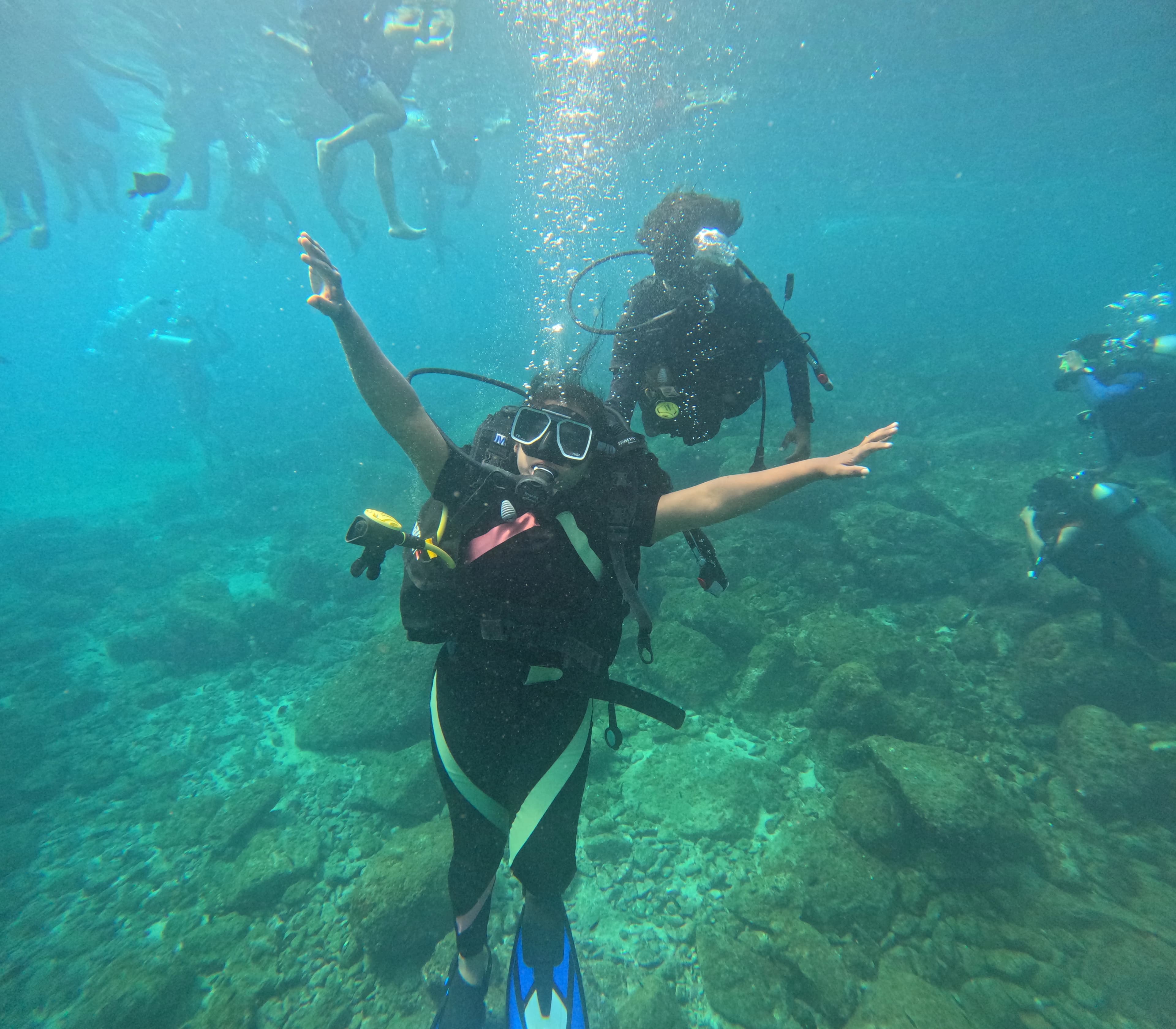 Scuba diver recording underwater memories during a guided Netrani Island dive