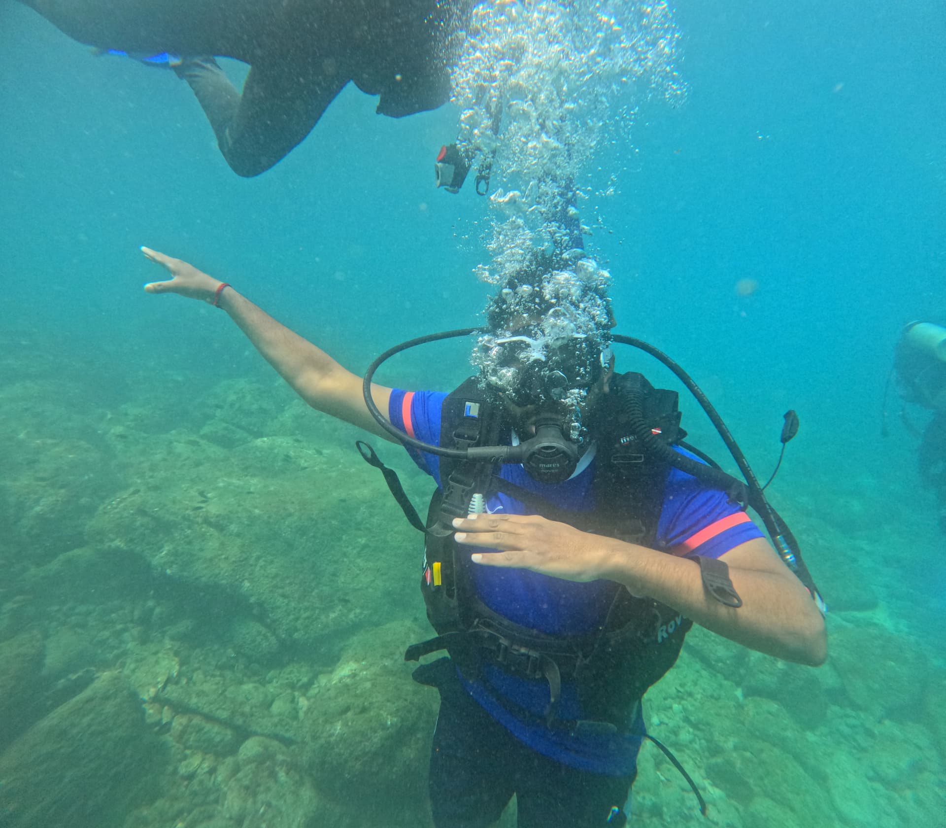 Open-water sea diving expedition with tropical reef fish in Netrani Island waters
